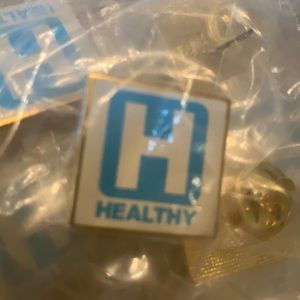 Pins with gold backing, in sealed bag, 100 of them
